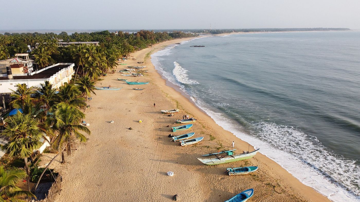 Fishing boats on the long beach at Arugam Bay