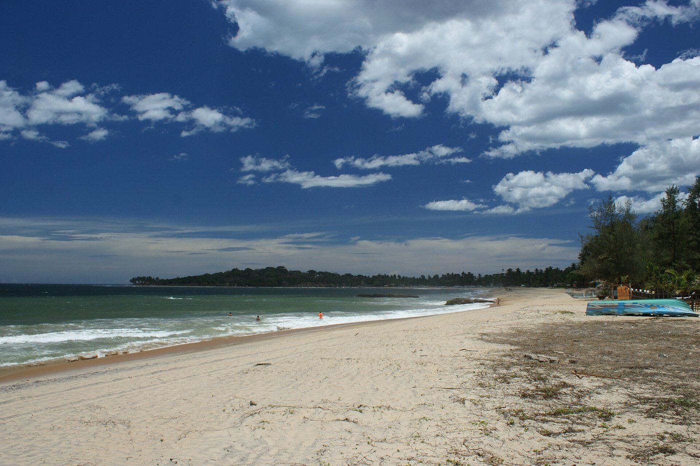Surf breaking along the coastline at Arugam Bay