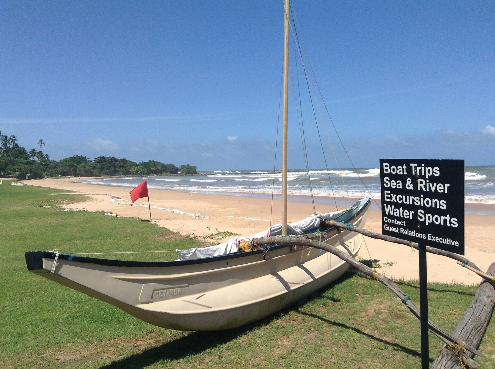 Traditional boat on the beach at Bentota, Sri Lanka
