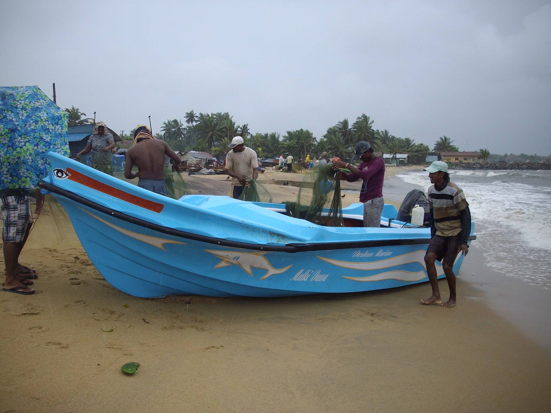Traditional fishing boat pulled up on Negombo Beach